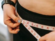 Woman measuring hips